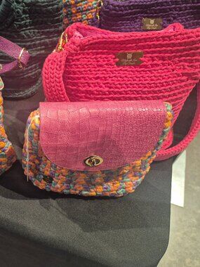 Beautiful handmade crocheted bags and a few designer bags and shopping bags